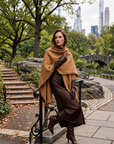Margot camel tweed wrap with fringe styled over brown dress