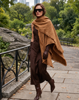 Margot camel fringe tweed wrap draped over shoulder